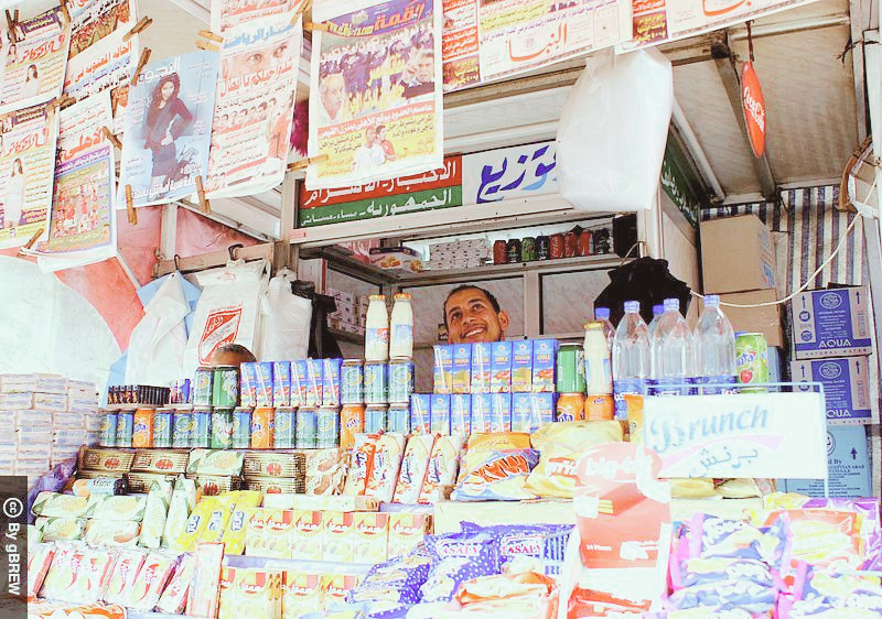 A small shop in Egypt with smiling shopkeeper